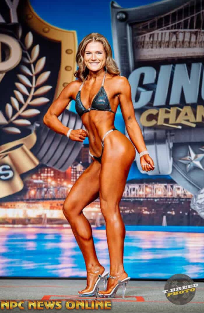 Female bikini competitor in a black suit at NPC Cincinnati