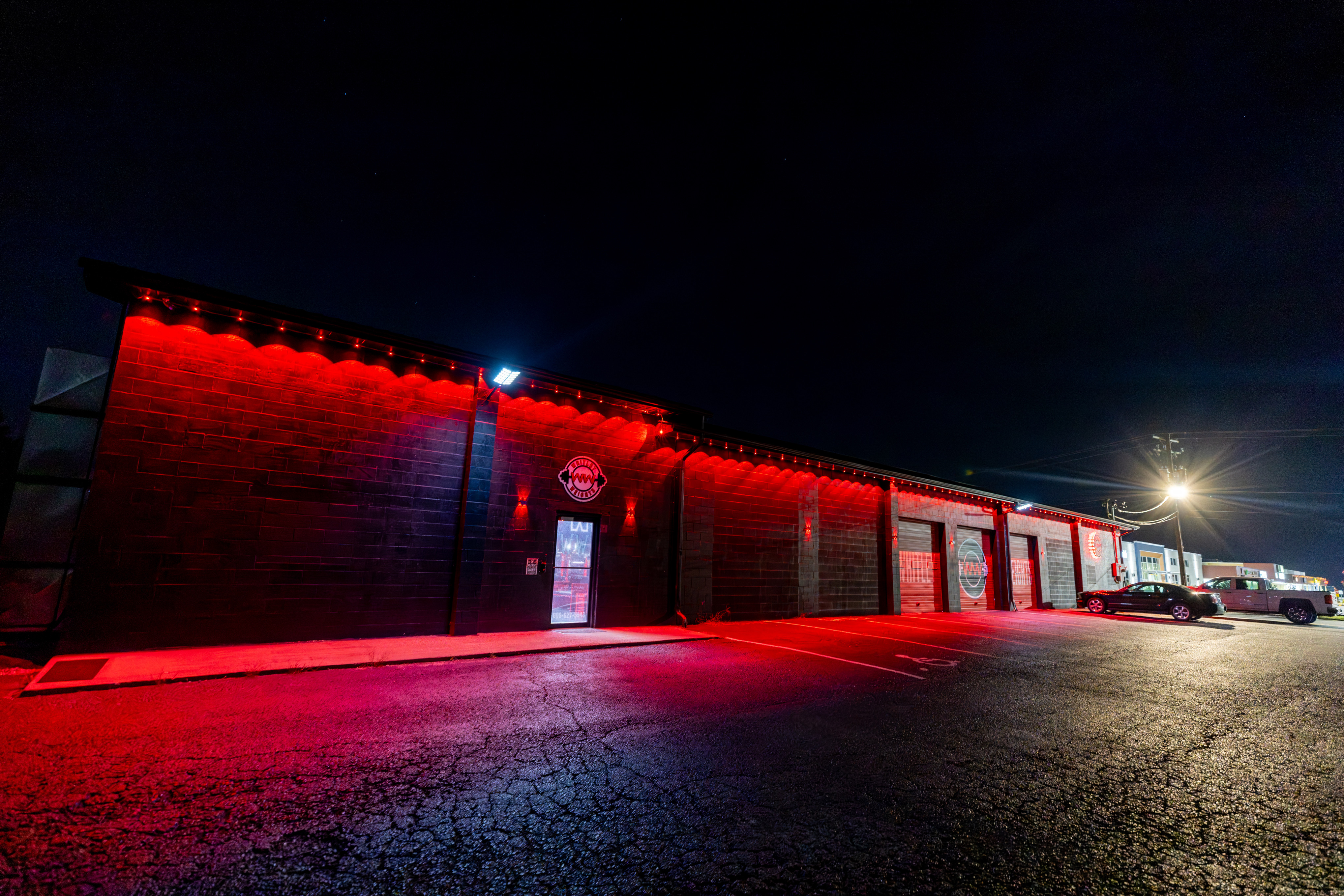 The Whitley Weights building lit red at night